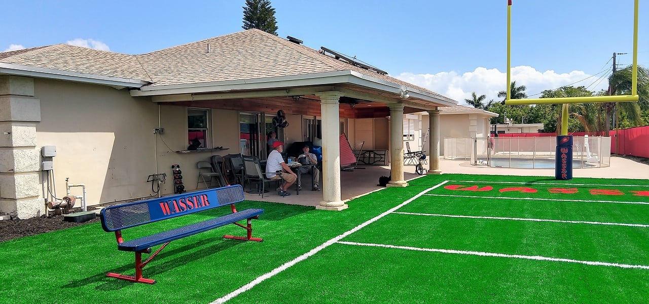 Azriel’s Wish: Park Warehouse donates a custom bench for one of kind football field.